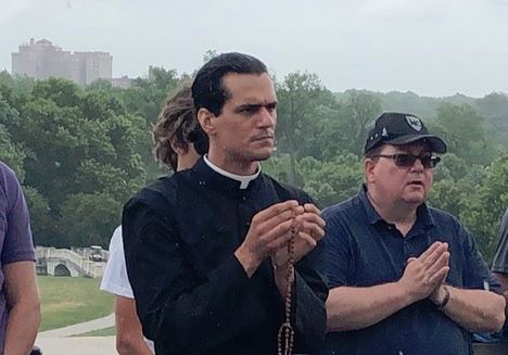 Fr. Miloscia leads the Joyful Mysteries at the statue of St. Louis.